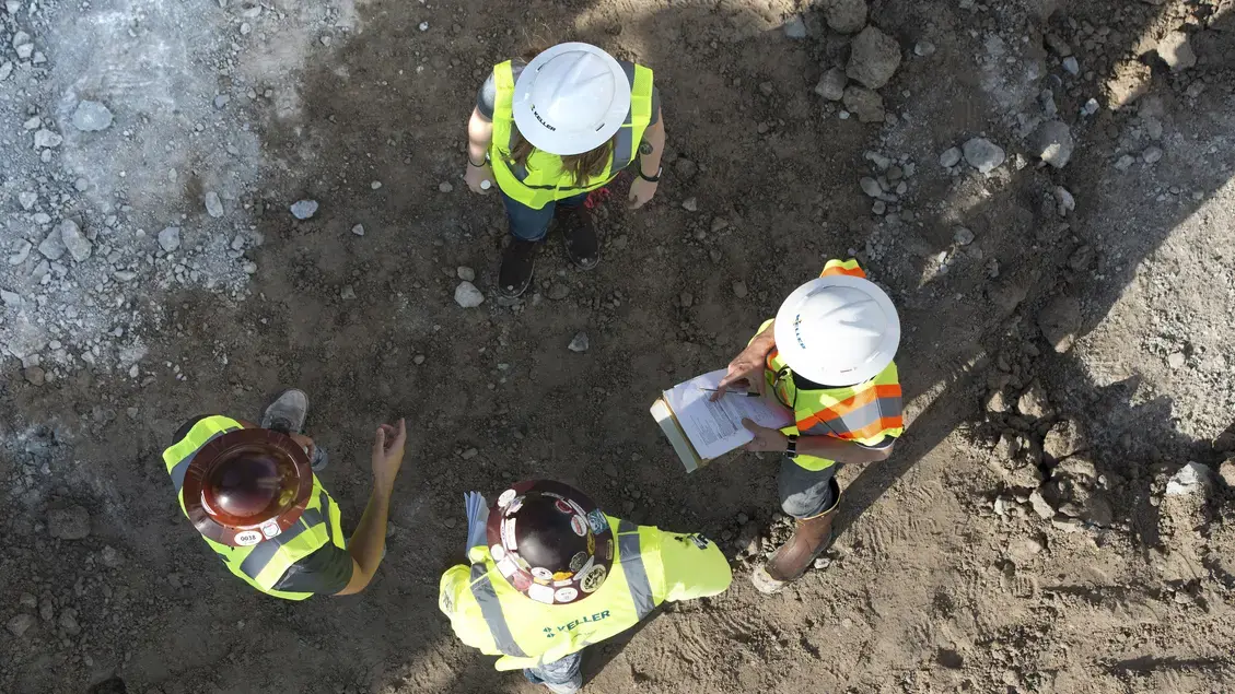 Birds-eye view of 4 employees in a circle