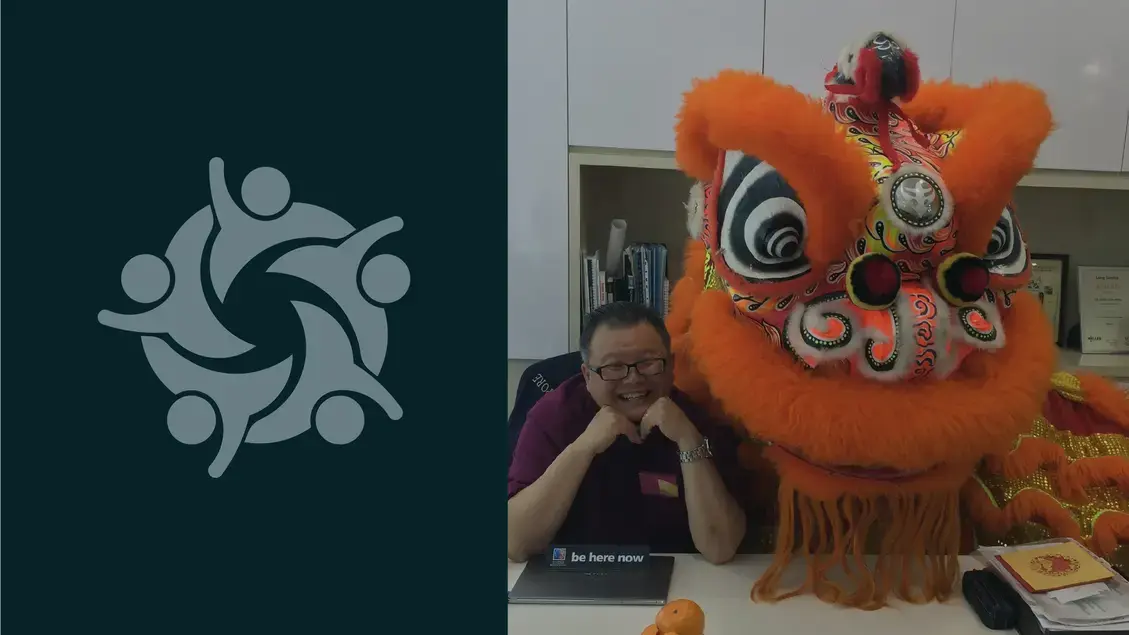 Employee posing with dragon