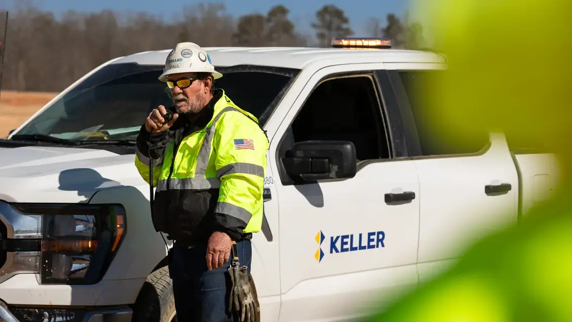 Worker speaking into a radio