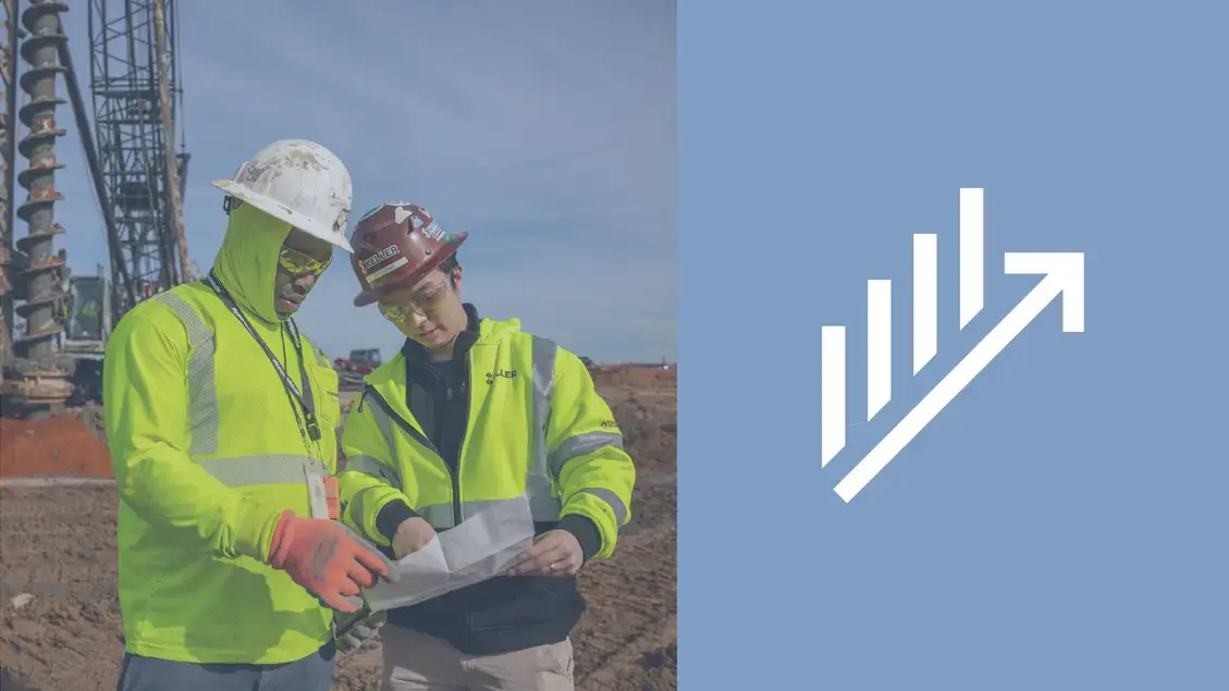 Two Keller employees reviewing a site plan