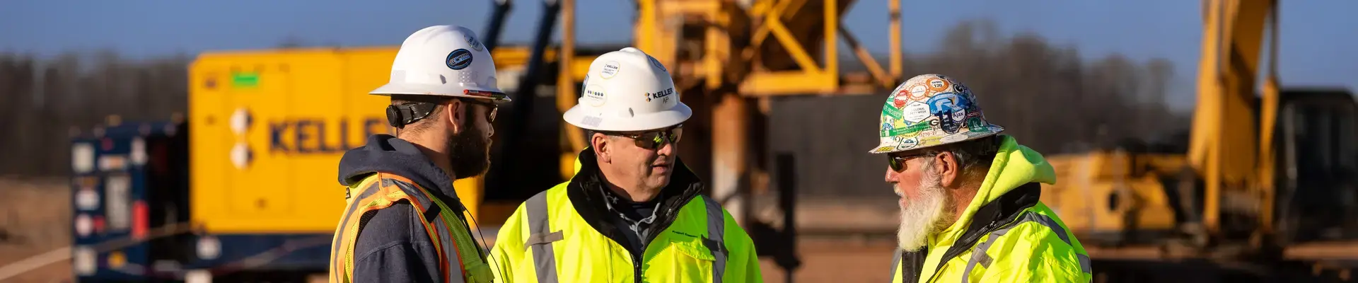 3 Keller employees talking on site