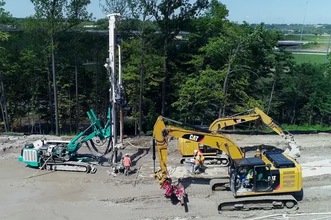 Micropile slide stabilization wall construction