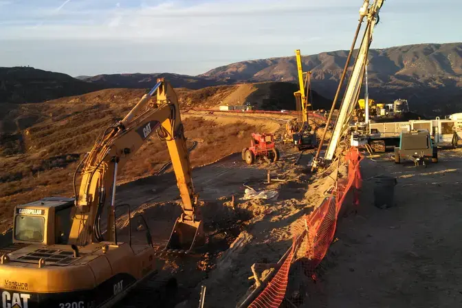 drill rigs on side of slope