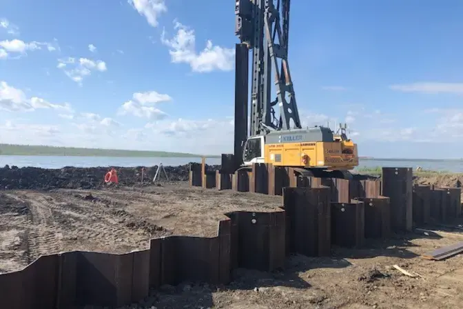 drill rig installing sheet piles
