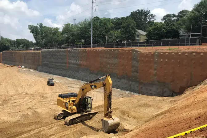 soil nail wall with excavator in front