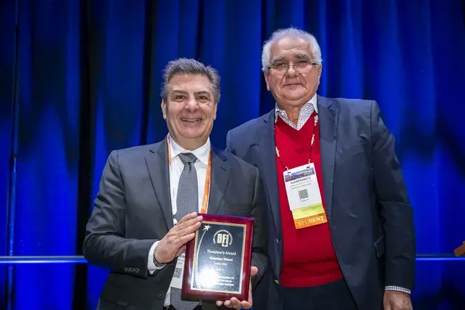 Massimo receiving his award