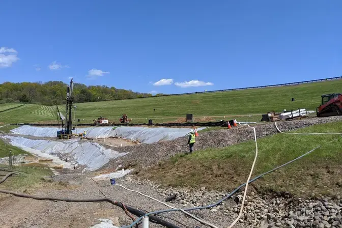 construction site at the bottom of the dam
