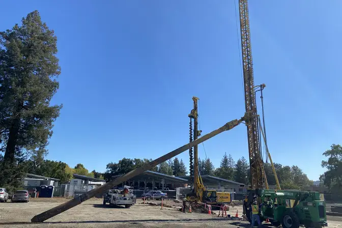 construction site with three rigs