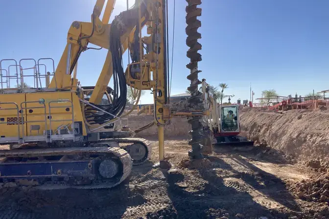 drill rig with auger performing auger cast piles