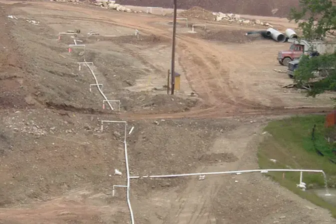 dewatering wells and pipes across a dam