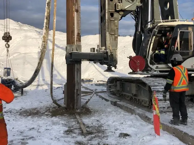 Close-up of an interlocking pipe pile being installed