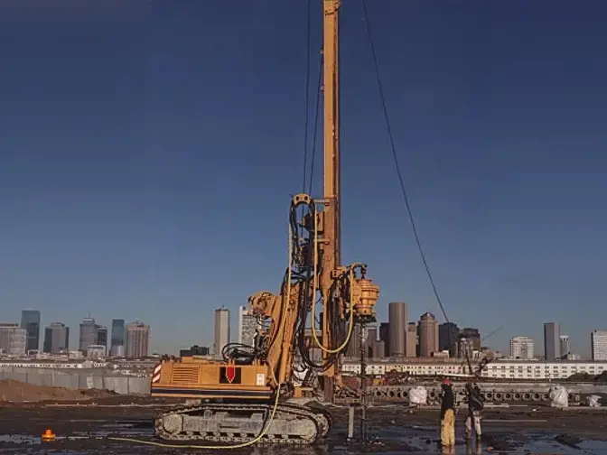 Rig on site with 2 workers