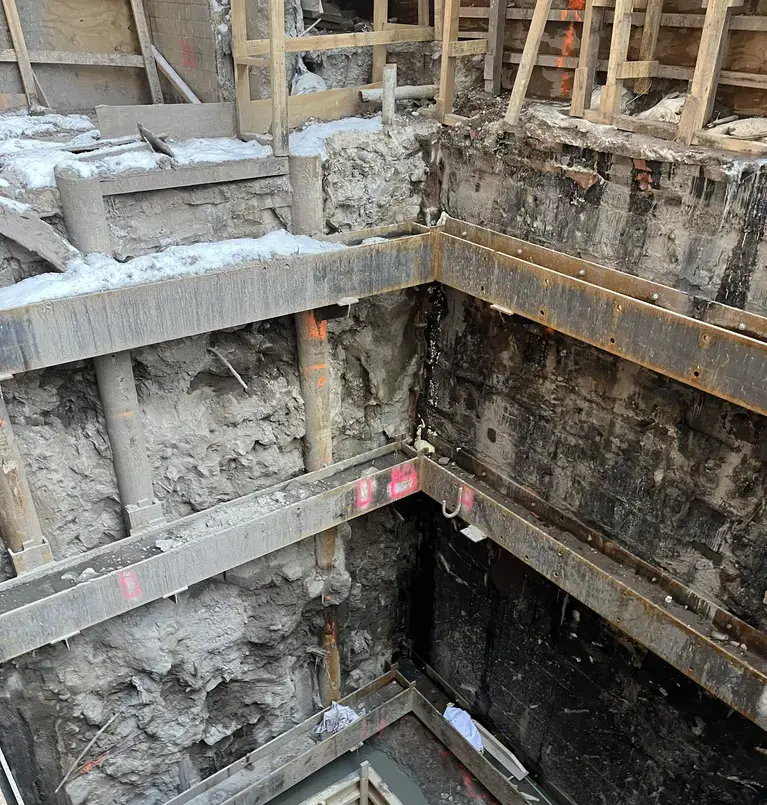 completed excavation showing micropiles and jet lagging with steel reinforcement