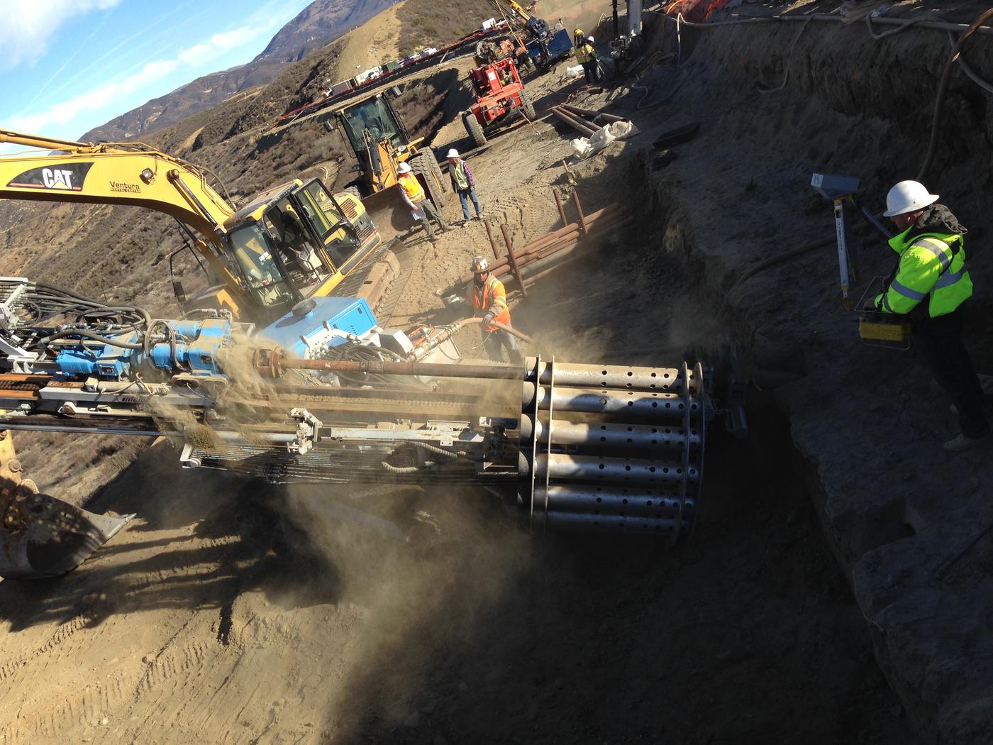 construction crew installing micropiles