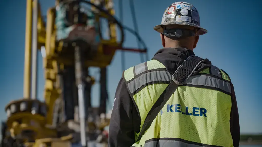 Back of an employee with Keller logo on vest