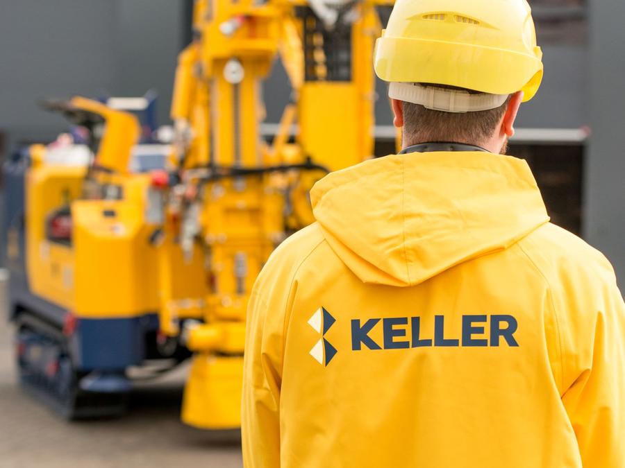 man in yellow jacket with keller logo on the back