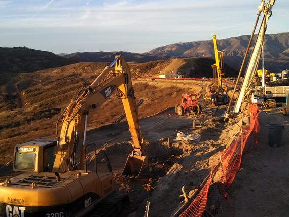 drill rigs on side of slope