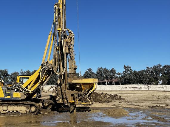 drill rig on a muddy jobsite