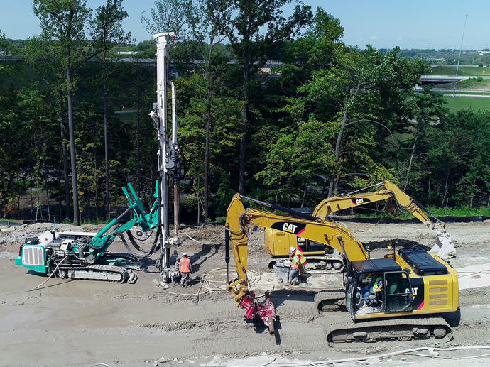 Micropile slide stabilization wall construction