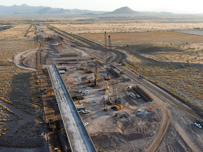 aerial view of half constructed bridge in the desert